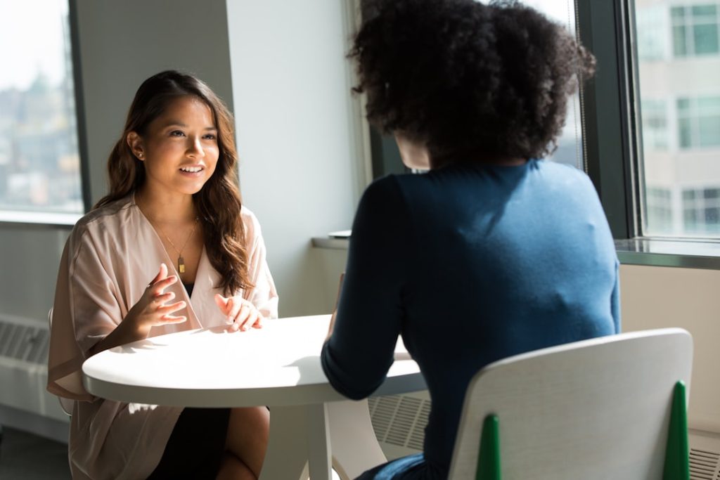 Black woman participating in a supportive job interview coaching session
